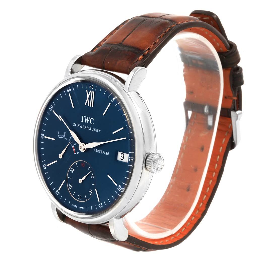 The IWC Portofino IW510106 Men
s Stainless Steel Blue Dial IW510106 Men
s Stainless Steel Blue Dial watch is shown at a three-quarter angle, displaying the face, dial, crown, and leather strap.