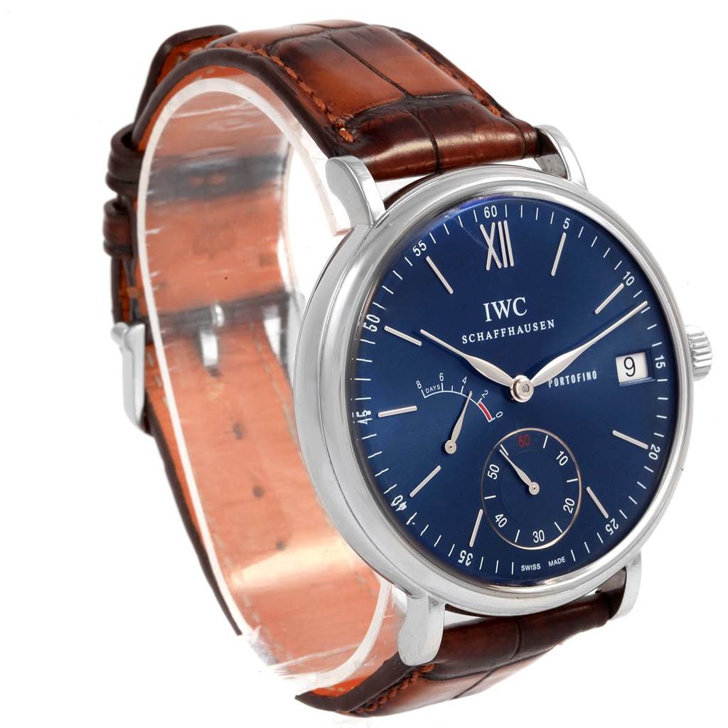 This image shows a close-up, angled view of the IWC Portofino IW510106 Men
s Stainless Steel Blue Dial IW510106 Men
s Stainless Steel Blue Dial watch, highlighting its blue dial, date display, subdials, and brown leather strap.