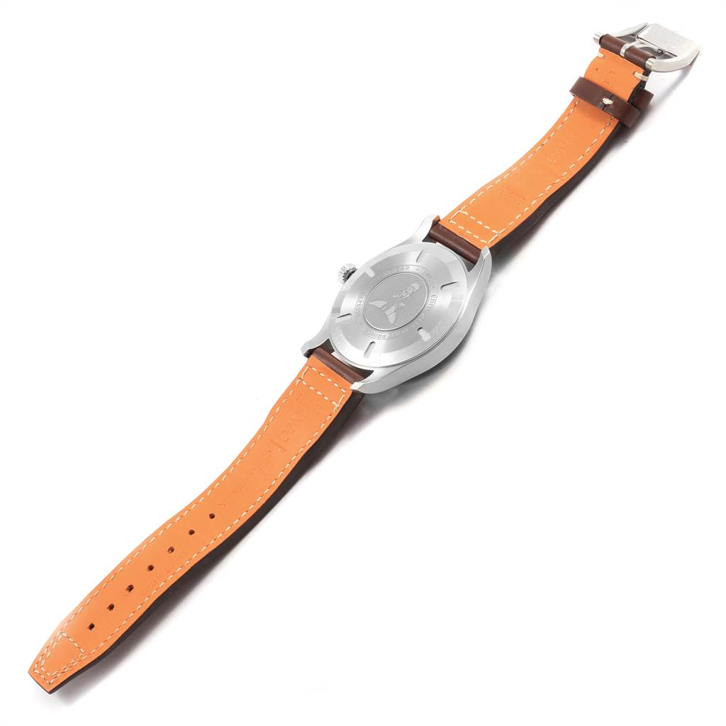 The image shows the back of an IWC Pilot IW327010 Men's Stainless Steel Blue Dial IW327010 Men's Stainless Steel Blue Dial model watch, including the case back and leather strap with stitching.