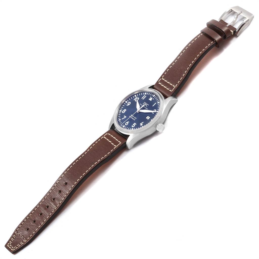 The IWC Pilot IW327010 Men's Stainless Steel Blue Dial IW327010 Men's Stainless Steel Blue Dial model watch is shown at a slight angle, displaying its face, crown, and full leather strap.