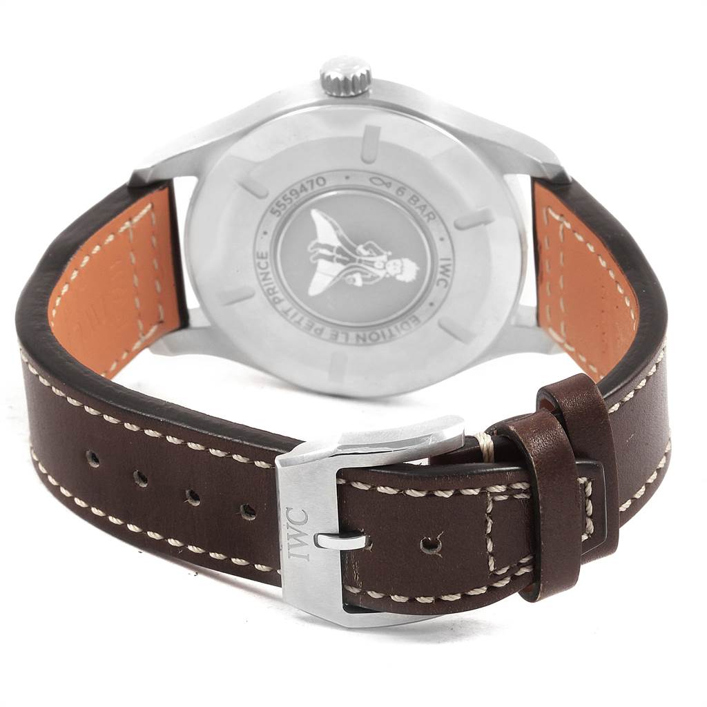 The image shows the back of the IWC Pilot IW327010 Men's Stainless Steel Blue Dial IW327010 Men's Stainless Steel Blue Dial model watch, featuring its case back and brown leather strap with stitching.