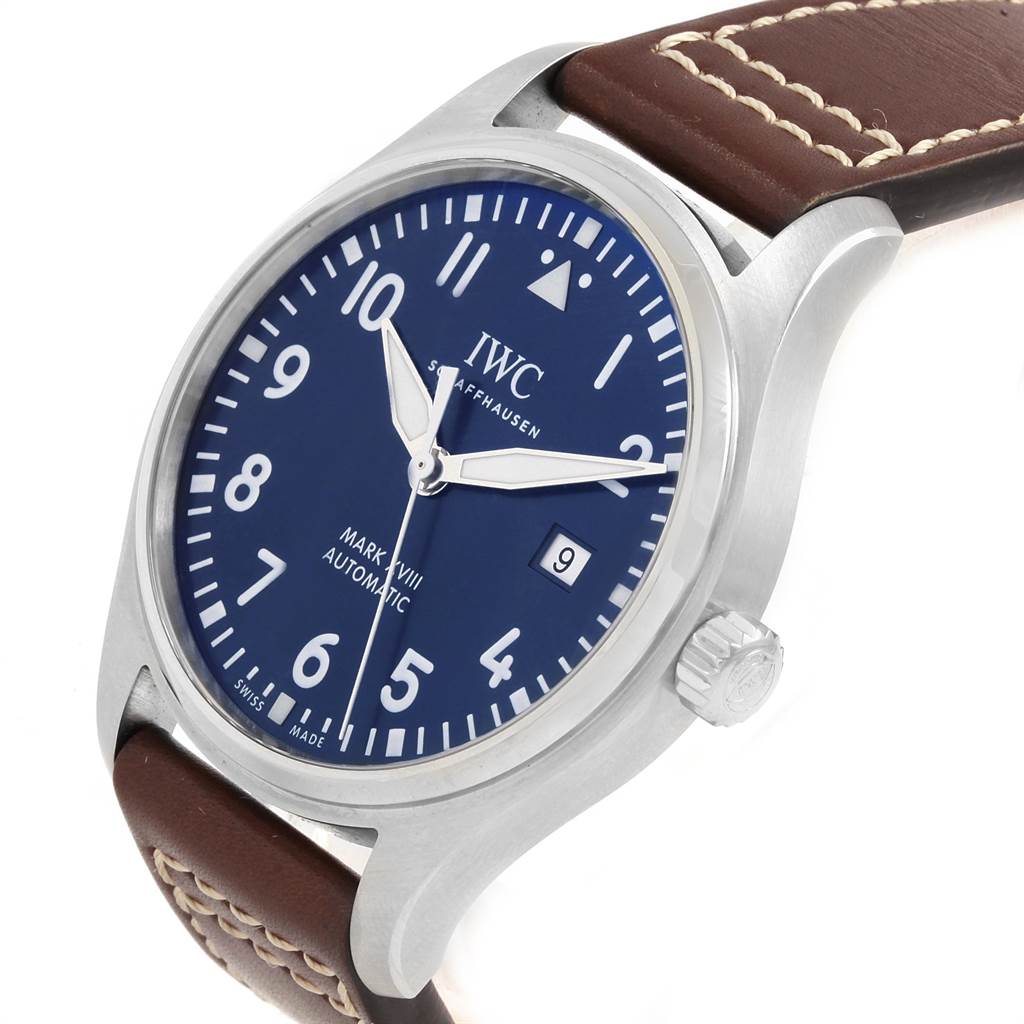 This image shows the IWC Pilot IW327010 Men's Stainless Steel Blue Dial IW327010 Men's Stainless Steel Blue Dial Mark XVIII watch with a blue dial, a stainless steel case, and a brown leather strap.