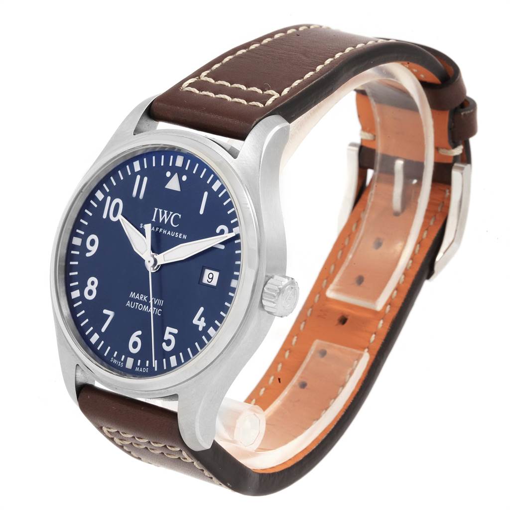 This image shows the IWC Pilot IW327010 Men's Stainless Steel Blue Dial IW327010 Men's Stainless Steel Blue Dial Mark XVIII watch from a three-quarter angle, highlighting the face, case, crown, and strap.