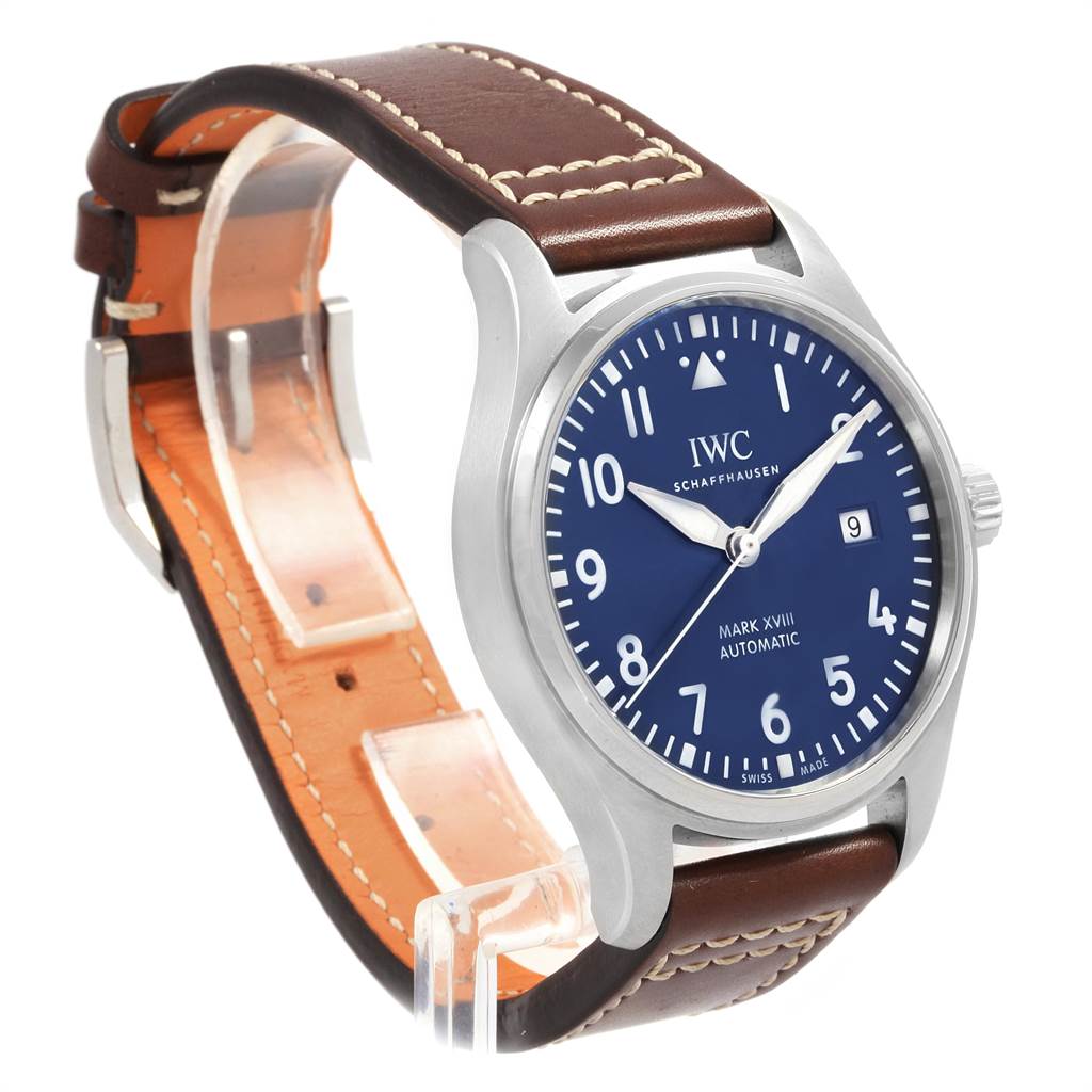The image shows an IWC Pilot IW327010 Men's Stainless Steel Blue Dial IW327010 Men's Stainless Steel Blue Dial model watch, featuring a blue dial and brown leather strap, displayed at an angle highlighting the face and side.