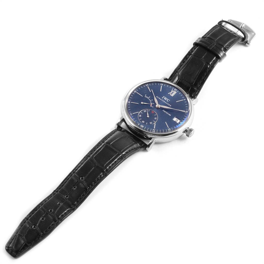 The IWC Portofino IW510106 Men's Stainless Steel Blue Dial IW510106 Men's Stainless Steel Blue Dial watch is shown from a top-down angle, displaying the face, straps, and buckle.