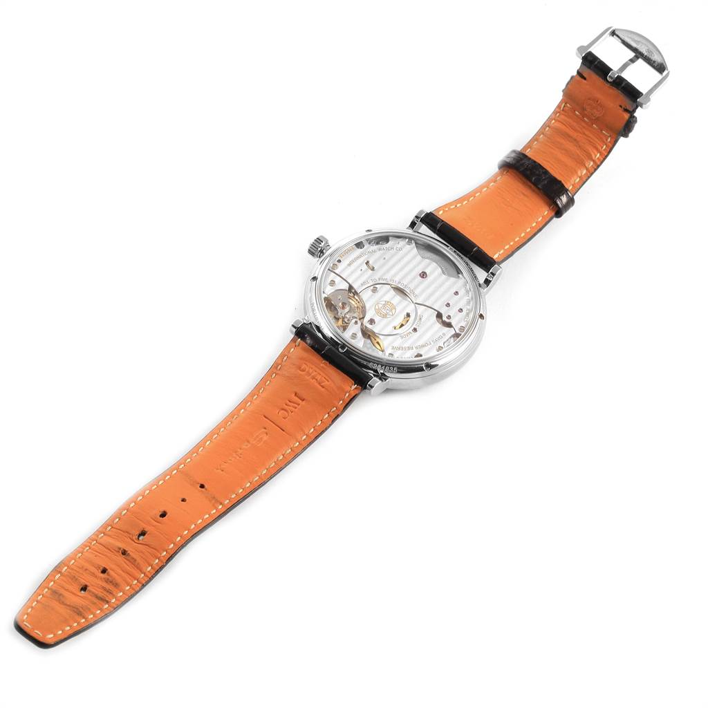 The image shows the back view of an IWC Portofino IW510106 Men's Stainless Steel Blue Dial IW510106 Men's Stainless Steel Blue Dial watch, highlighting the movement and orange leather strap.