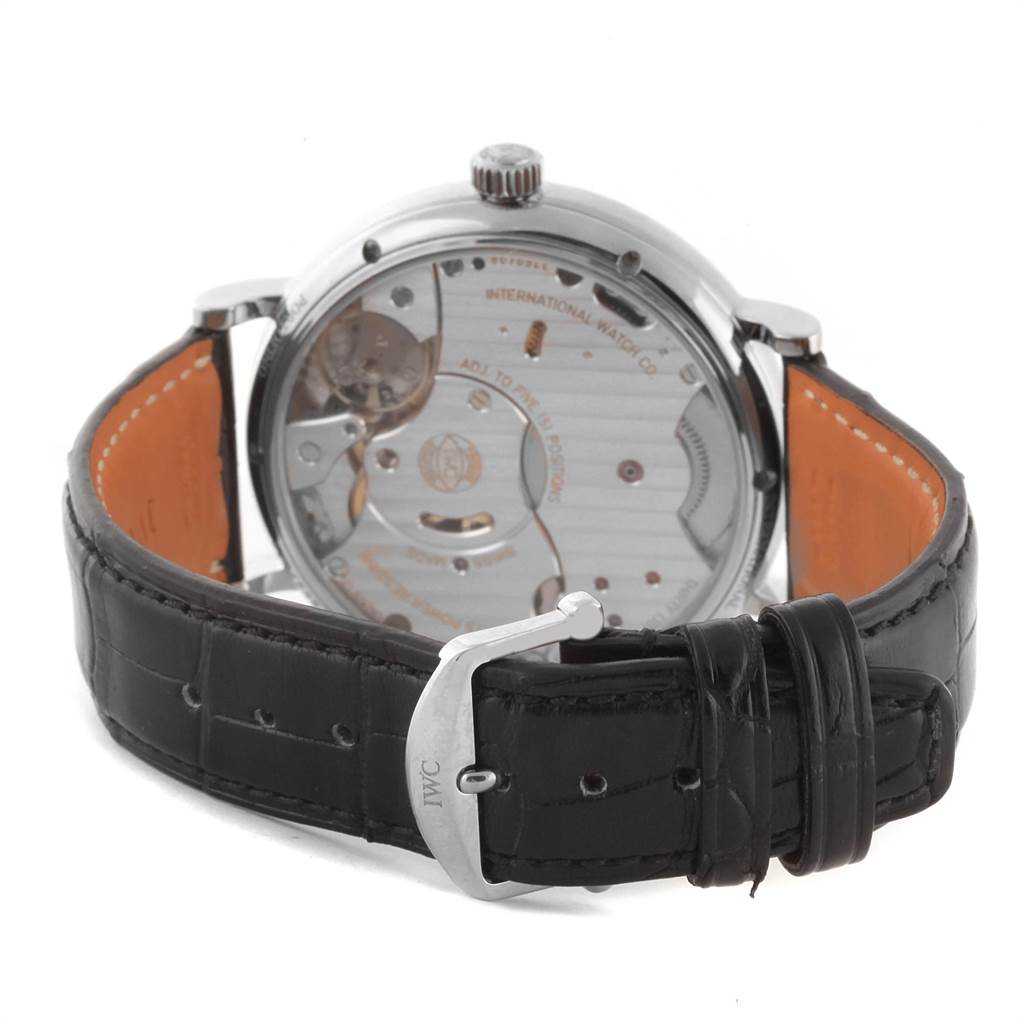 The image shows the back view of an IWC Portofino IW510106 Men's Stainless Steel Blue Dial IW510106 Men's Stainless Steel Blue Dial watch, highlighting its movement and black leather strap with a buckle.