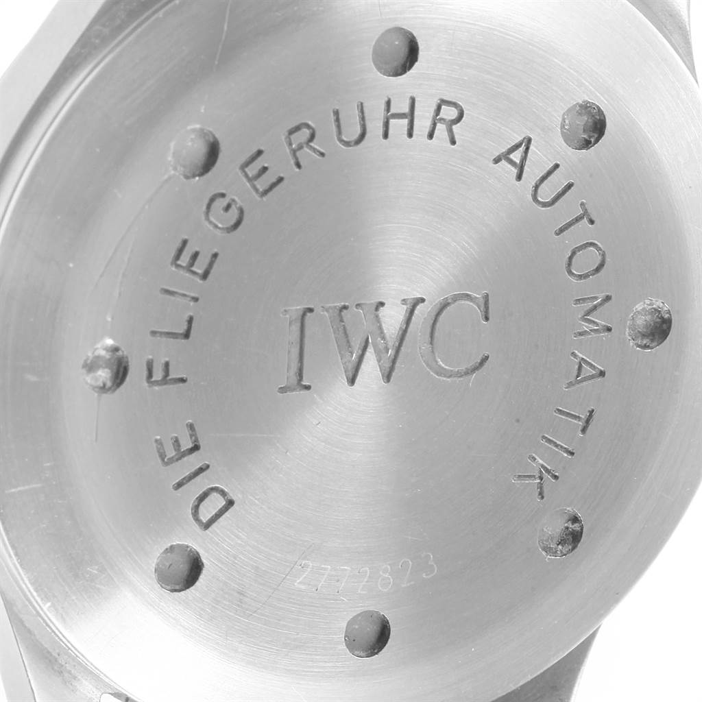This image shows the case back of an IWC Pilot IW325301 Men's Stainless Steel Black Dial IW325301 Men's Stainless Steel Black Dial watch with engravings and rivets.