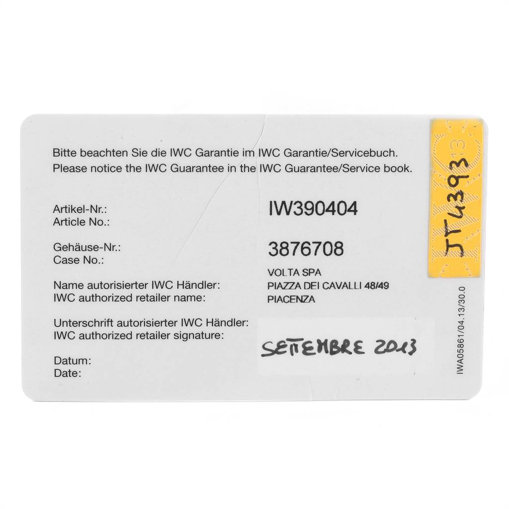 The image shows an IWC Portuguese IW390404 Men's Stainless Steel Grey Dial IW390404 Men's Stainless Steel Grey Dial model warranty card with details like article number, case number, and authorized retailer information.