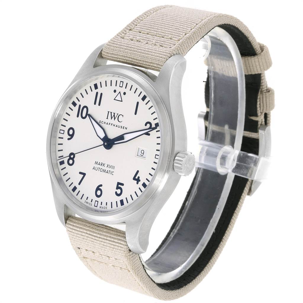 The image shows an IWC Pilot IW327017 Men's Stainless Steel Silver Dial IW327017 Men's Stainless Steel Silver Dial Mark XVIII Automatic watch at a three-quarter view, displaying the face, crown, and beige strap.