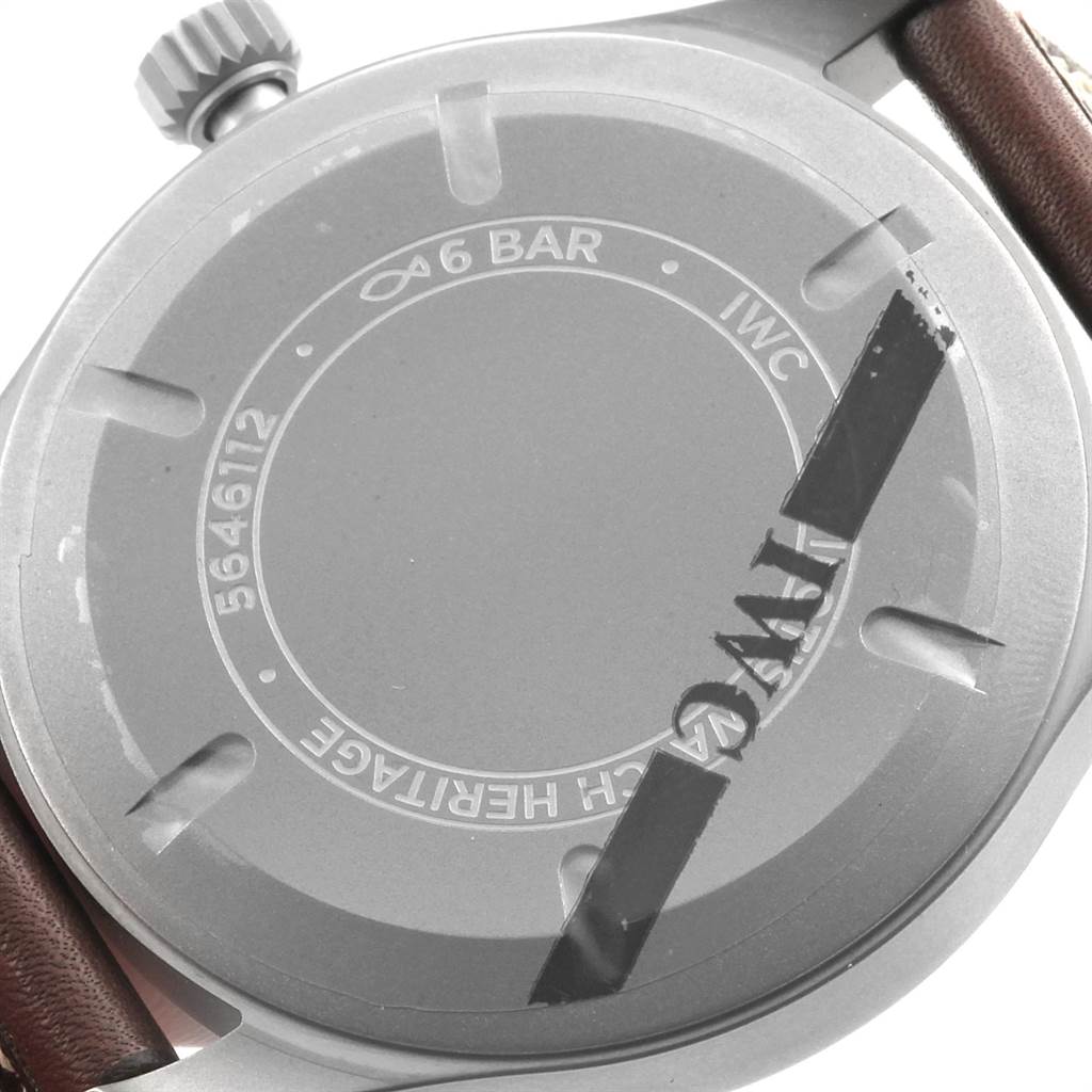 The image shows the back of the IWC Pilot IW327006 Men's Titanium Black Dial IW327006 Men's Titanium Black Dial watch, including the crown and part of the leather strap.