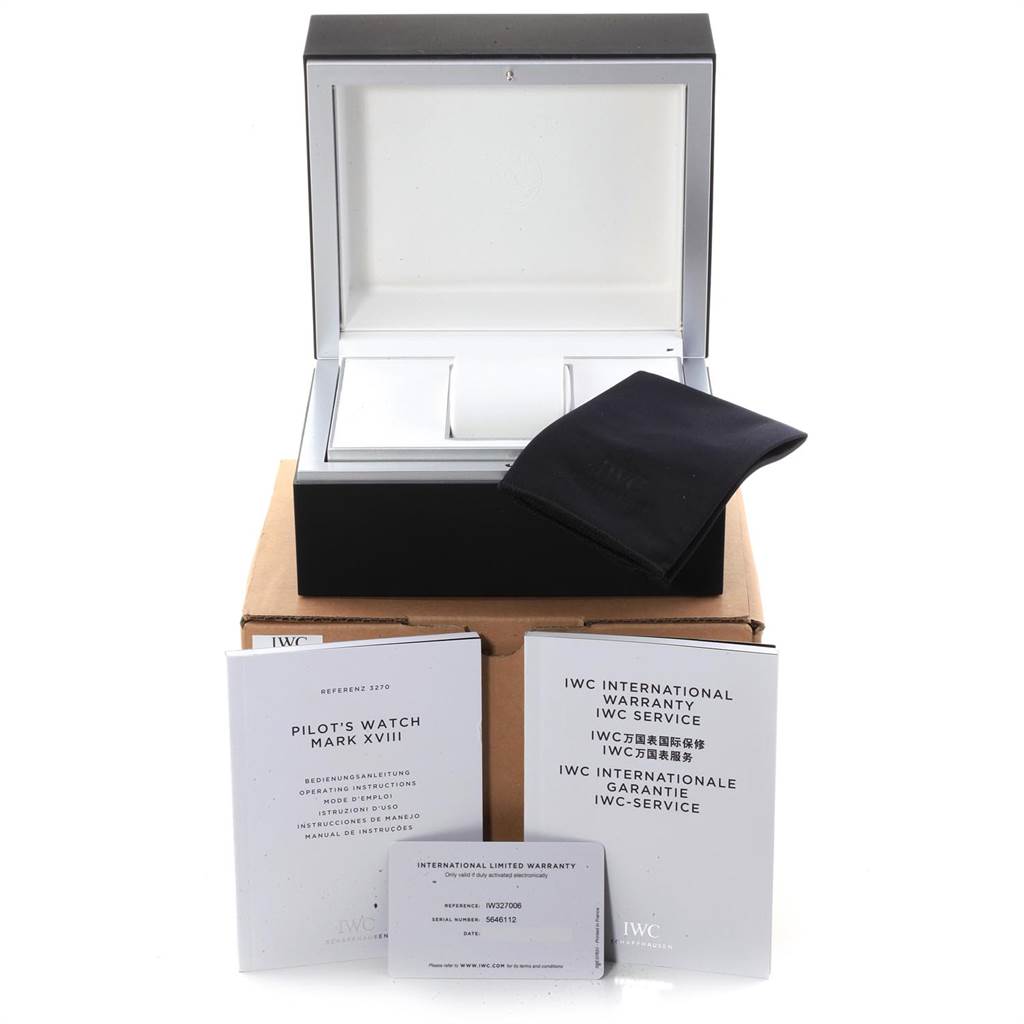 The image shows the open packaging box, manuals, warranty card, and cleaning cloth for the IWC Pilot IW327006 Men's Titanium Black Dial IW327006 Men's Titanium Black Dial's Watch Mark XVIII.