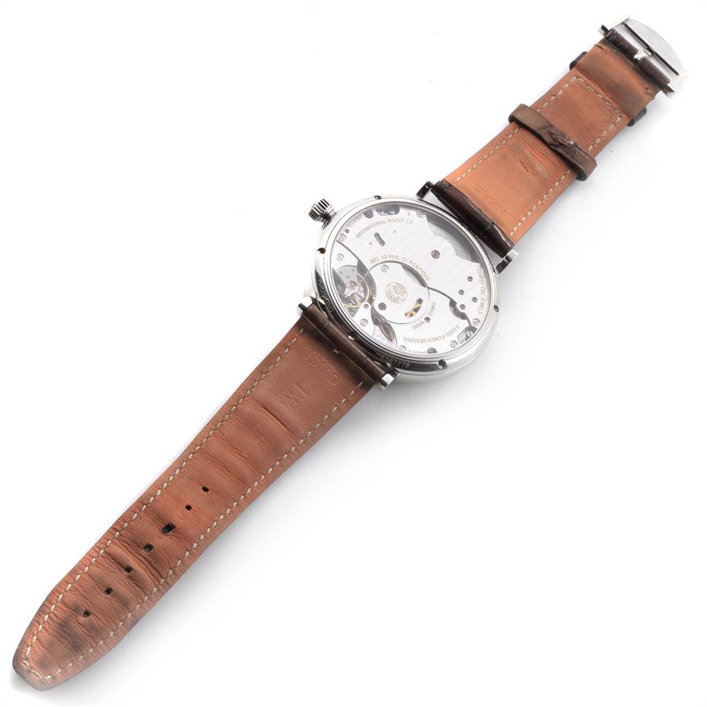 The image shows the back of the IWC Portofino IW510103 Men's Stainless Steel Silver Dial IW510103 Men's Stainless Steel Silver Dial watch, highlighting its internal mechanism and brown leather strap.