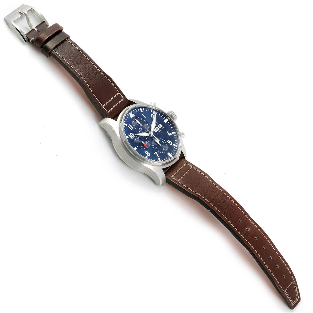 The IWC Pilot IW377714 Men's Stainless Steel Blue Dial IW377714 Men's Stainless Steel Blue Dial model watch is shown at a slight side angle, featuring its blue dial, brown leather strap, and stainless steel buckle.
