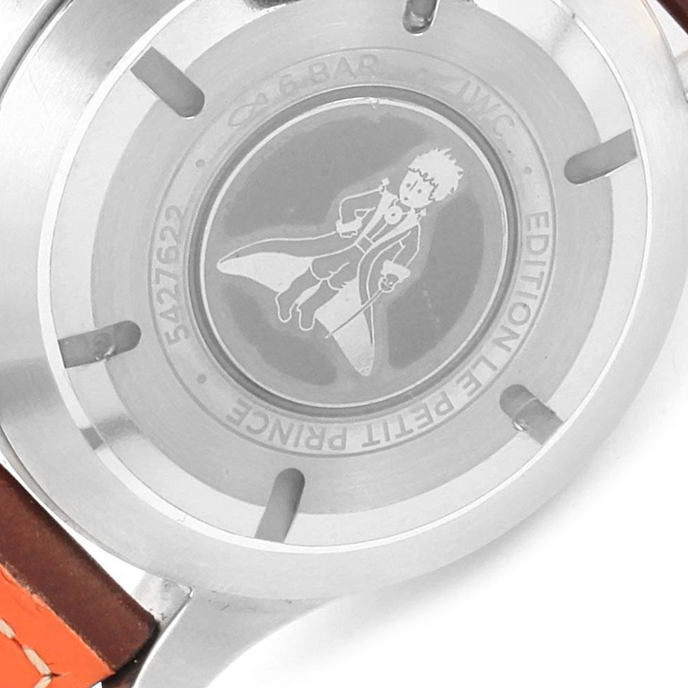 The image shows the back of an IWC Pilot IW377714 Men's Stainless Steel Blue Dial IW377714 Men's Stainless Steel Blue Dial model watch, featuring "Le Petit Prince" engraving.