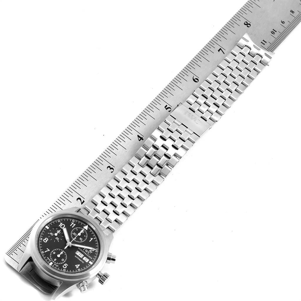 The image shows the IWC Pilot IW370603 Men's Stainless Steel Black Dial IW370603 Men's Stainless Steel Black Dial watch's face and band from a top-down angle, measured with a ruler.