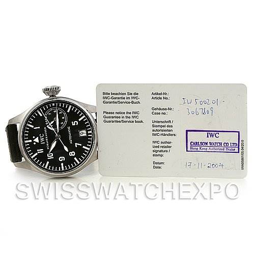 The image shows a frontal view of the IWC Pilot IW500201 OR 5002-01 Men
s Stainless Steel Black Dial IW500201 OR 5002-01 Men
s Stainless Steel Black Dial watch alongside its warranty card.
