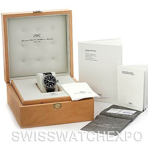 The IWC Pilot IW500201 OR 5002-01 Men
s Stainless Steel Black Dial IW500201 OR 5002-01 Men
s Stainless Steel Black Dial model watch is shown from a front angle inside an open wooden box, accompanied by booklets, a cloth, and a pouch.