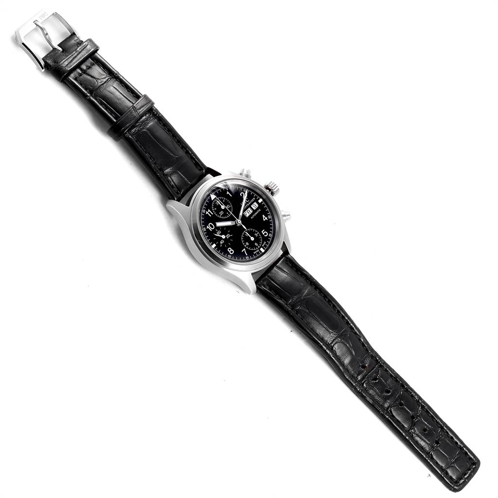 The IWC Pilot IW370603 Men's Stainless Steel Black Dial IW370603 Men's Stainless Steel Black Dial watch is shown in a top-down view featuring its black dial, chronograph subdials, and black leather strap.