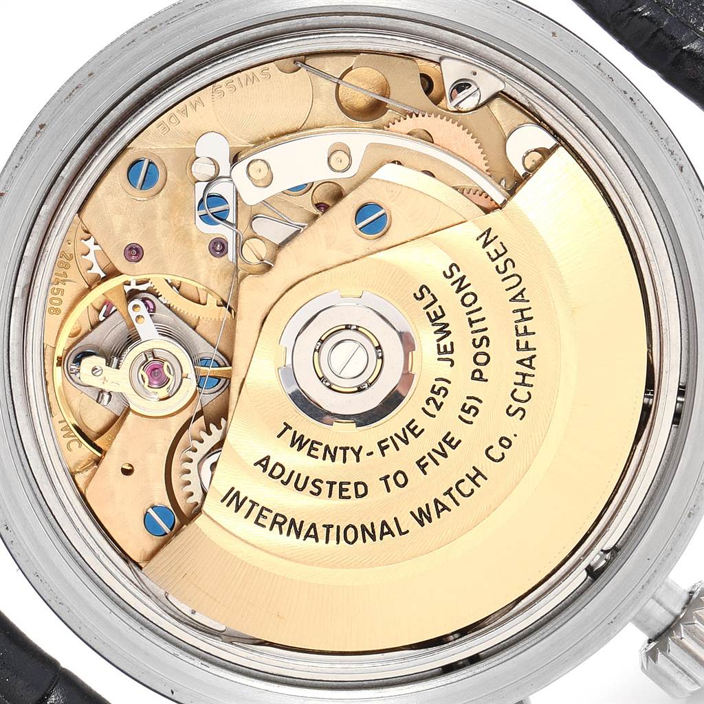 The image shows the movement mechanism of the IWC Pilot IW370603 Men's Stainless Steel Black Dial IW370603 Men's Stainless Steel Black Dial watch model viewed from the back, highlighting its internal components.