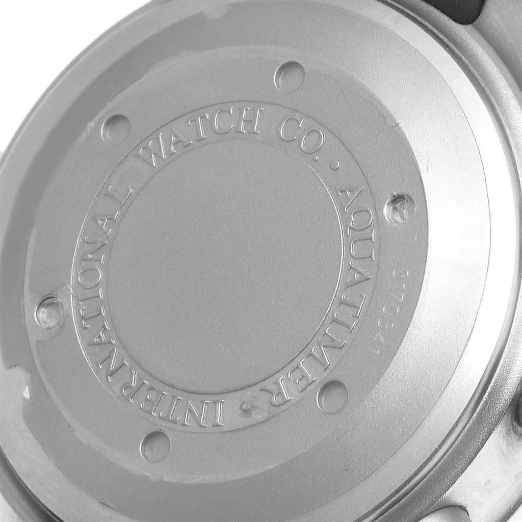 The image shows the back case of an IWC GST IW371918 Men's Titanium Black Dial IW371918 Men's Titanium Black Dial model watch, featuring engraved markings and secured with screws.