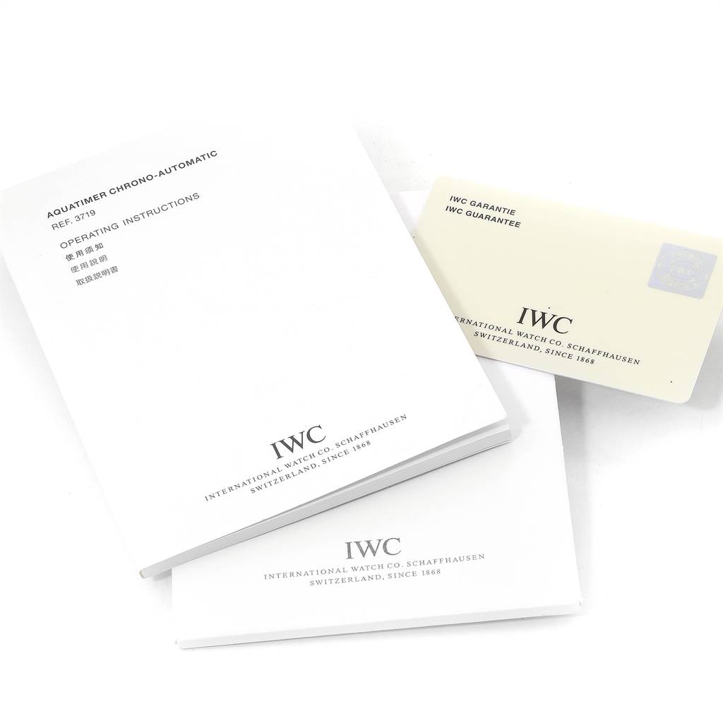 The image shows the IWC operating instructions booklet and guarantee card for the GST model.