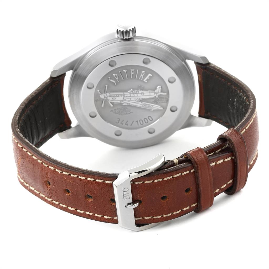 The image shows the back view of an IWC Pilot IW3253005 Men's Stainless Steel Black Dial IW3253005 Men's Stainless Steel Black Dial Spitfire watch, highlighting its case back and leather strap with a branded buckle.