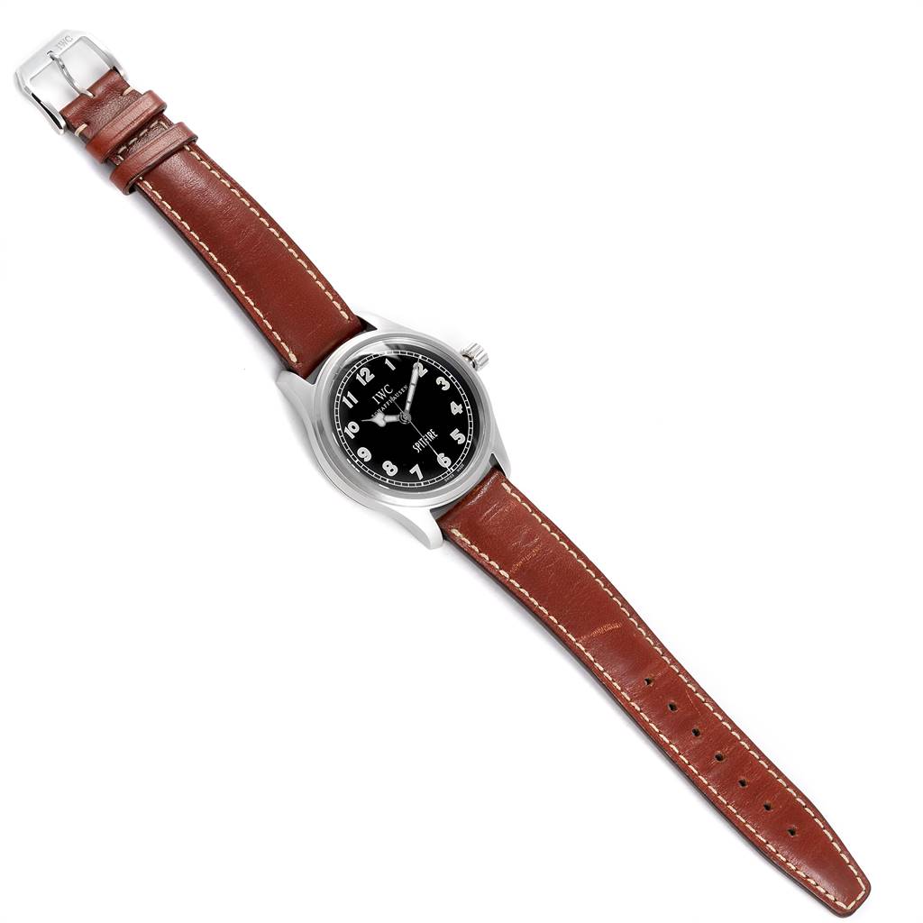 The IWC Pilot IW3253005 Men's Stainless Steel Black Dial IW3253005 Men's Stainless Steel Black Dial watch is shown flat from a top-down angle, displaying the face, case, crown, and the full brown leather strap.