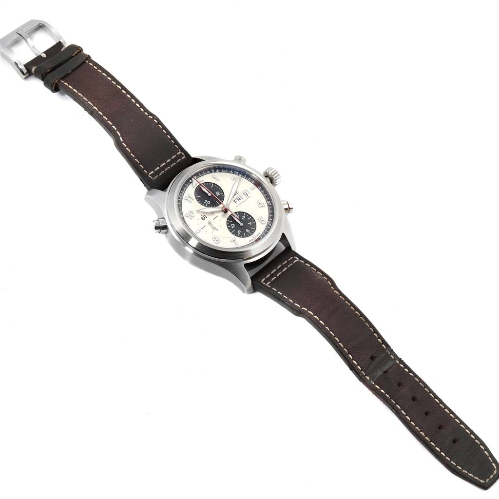 The image shows an IWC Pilot IW3253005 Men's Stainless Steel Silver Dial IW3253005 Men's Stainless Steel Silver Dial model watch at an angled top-down view, highlighting the dial, case, and leather strap.