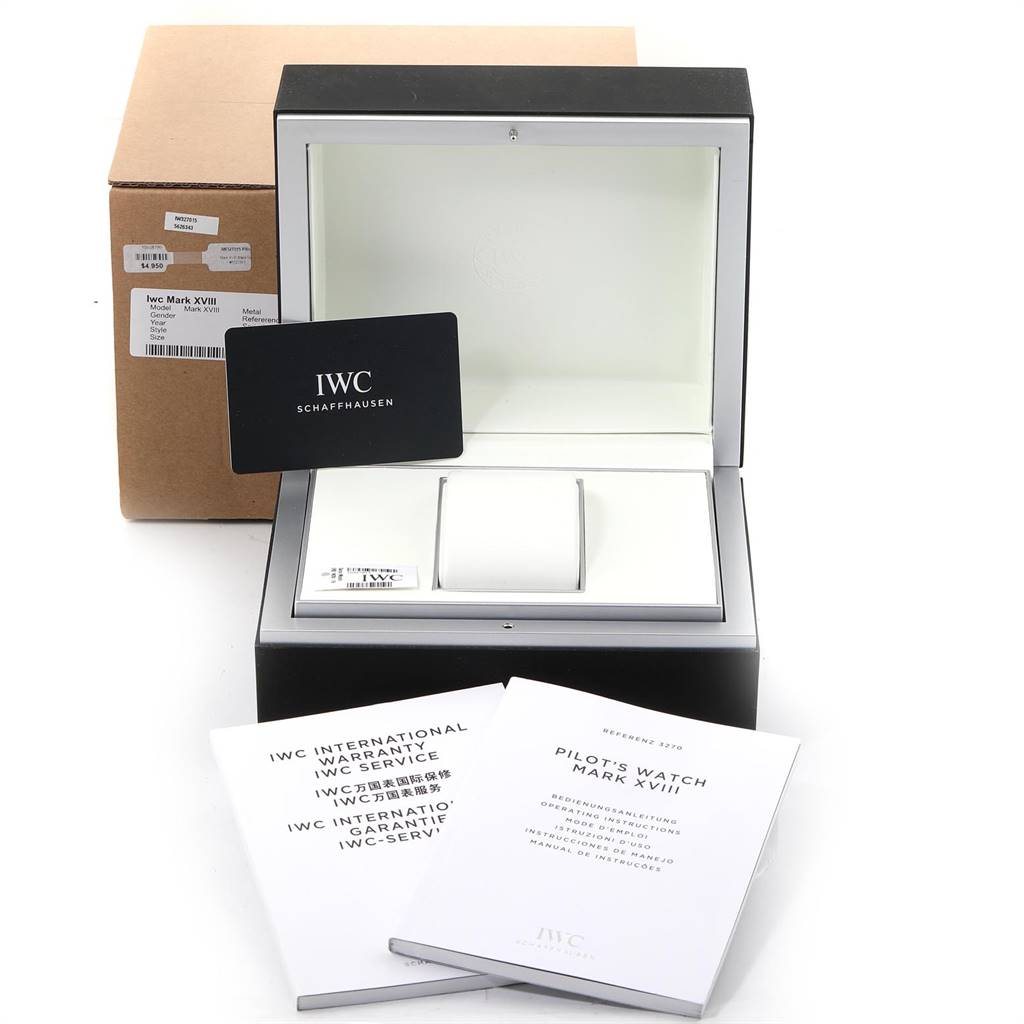 The image shows the box, paperwork, and warranty card for an IWC Pilot IW327015 Men's Stainless Steel Black Dial IW327015 Men's Stainless Steel Black Dial's Watch Mark XVIII.