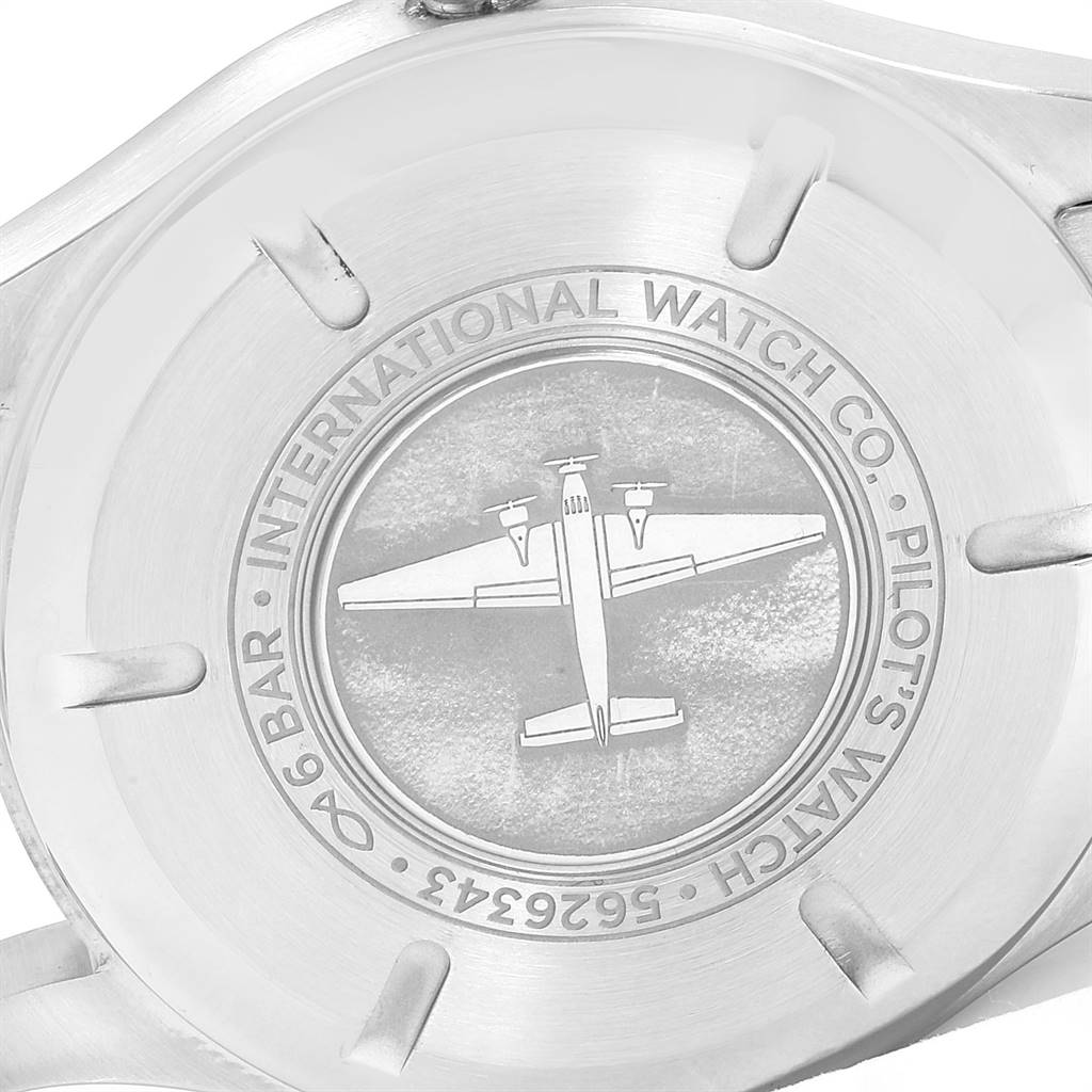 The image shows the back case of an IWC Pilot IW327015 Men's Stainless Steel Black Dial IW327015 Men's Stainless Steel Black Dial model watch, featuring an engraved airplane and brand details.
