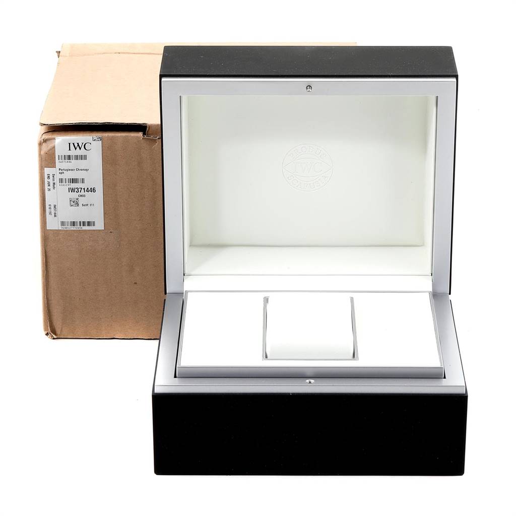 The image shows the opened watch box of the IWC Portuguese IW371438 Men's Stainless Steel Black Dial IW371438 Men's Stainless Steel Black Dial model, alongside its original outer cardboard packaging.