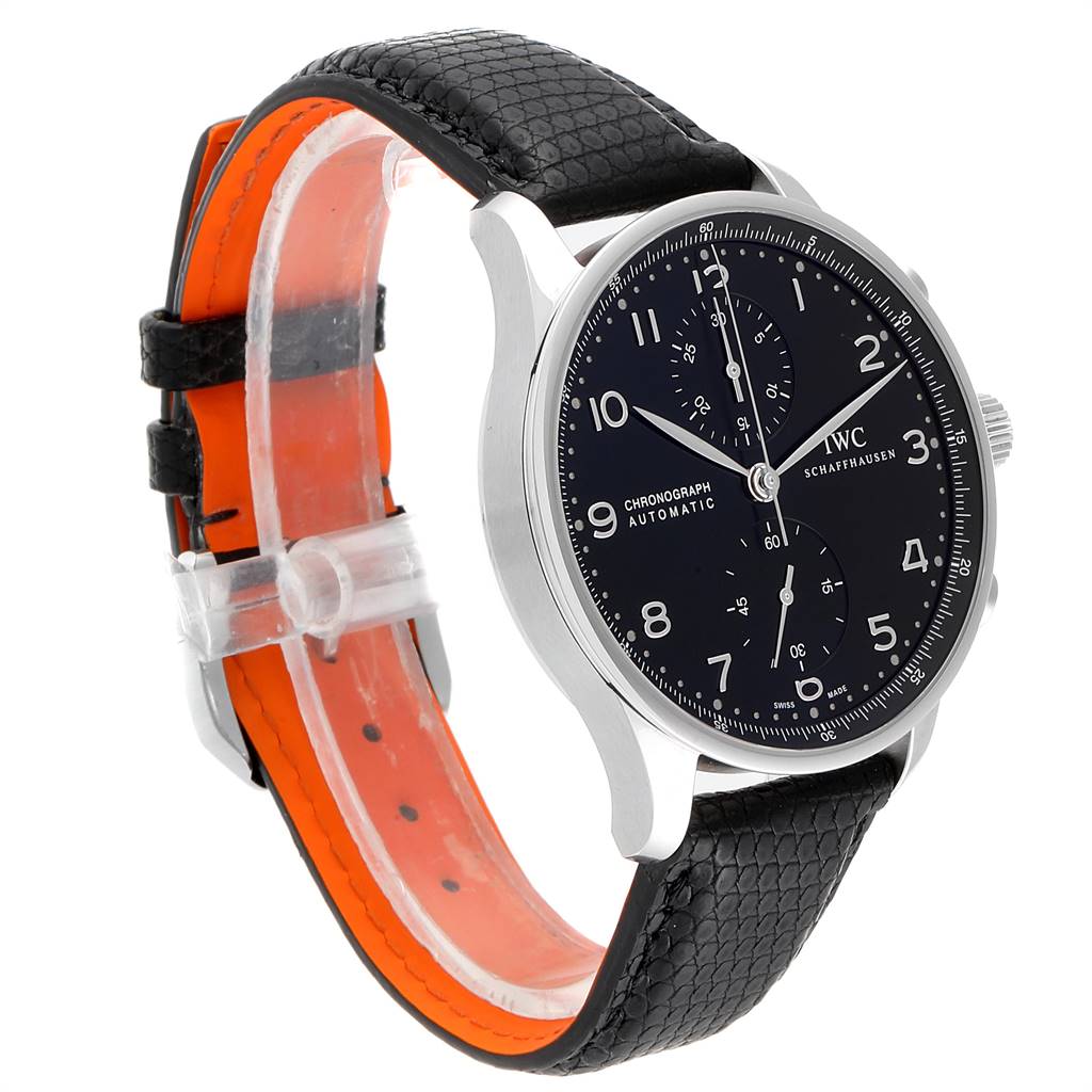 The image shows an IWC Portuguese IW371438 Men's Stainless Steel Black Dial IW371438 Men's Stainless Steel Black Dial model watch from a front-side angle, featuring a black dial and black leather strap with an orange interior.