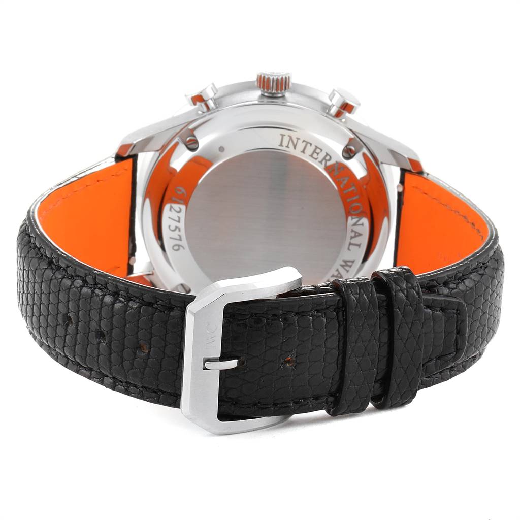 The image shows the back case, crown, and leather strap with a buckle of the Portuguese watch model by IWC.