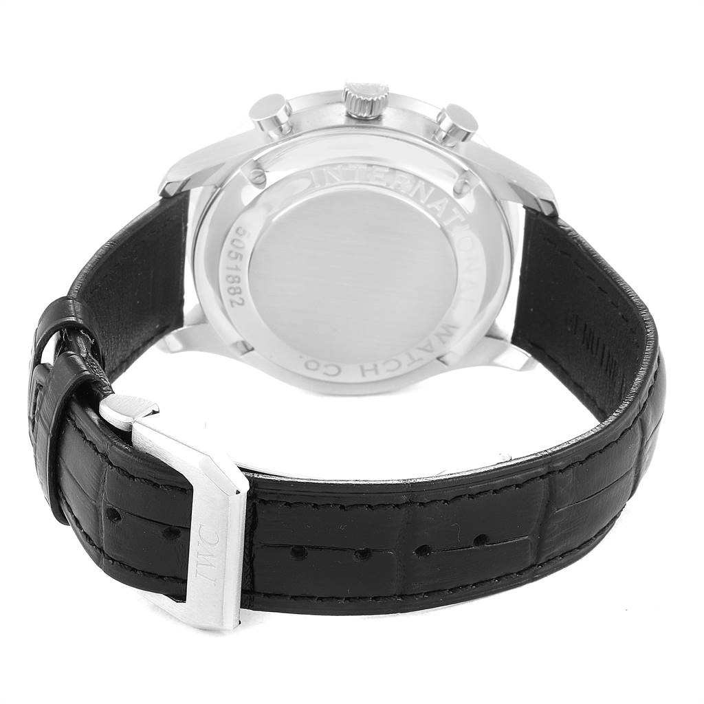 The image shows the back view of an IWC Portuguese IW371445 Men
s Stainless Steel Silver Dial IW371445 Men
s Stainless Steel Silver Dial model watch with its black leather strap and metal clasp visible.