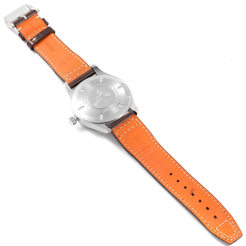 The image shows the back view of the IWC Pilot IW327004 Men's Stainless Steel Blue Dial IW327004 Men's Stainless Steel Blue Dial model watch, highlighting its case back and an orange leather strap.