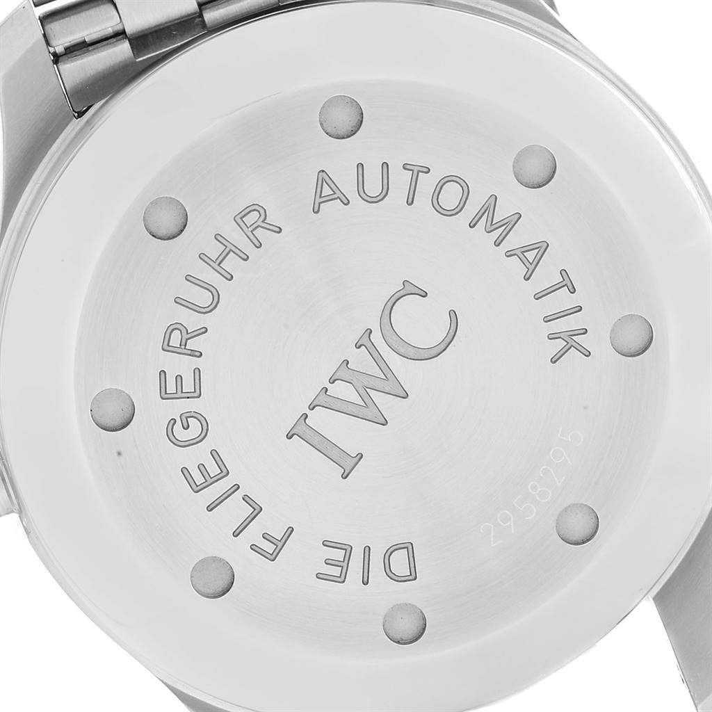 The image shows the back casing of the IWC Pilot IW325505 Men's Stainless Steel Silver Dial IW325505 Men's Stainless Steel Silver Dial watch model, highlighting its engraved details.