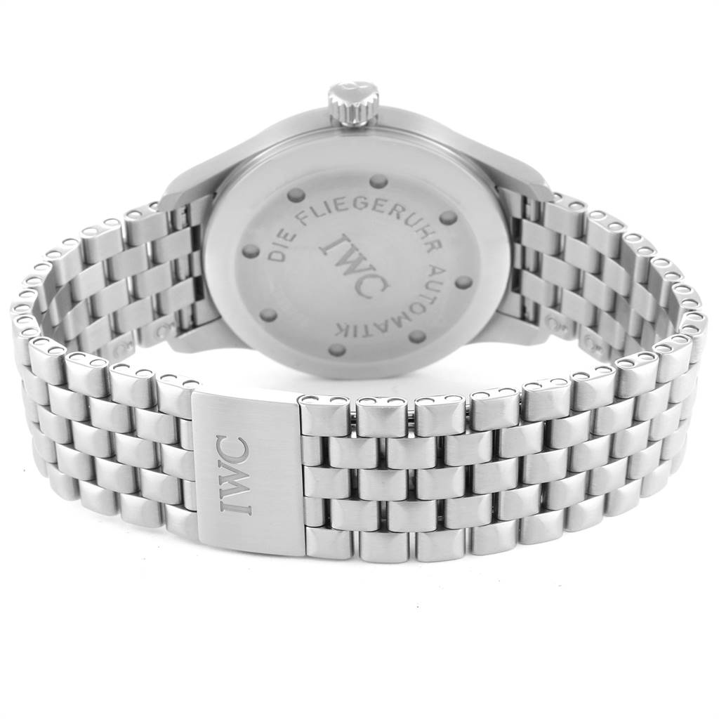 The image shows the back view of an IWC Pilot IW325505 Men's Stainless Steel Silver Dial IW325505 Men's Stainless Steel Silver Dial model watch, focusing on the case back and the metal bracelet clasp.