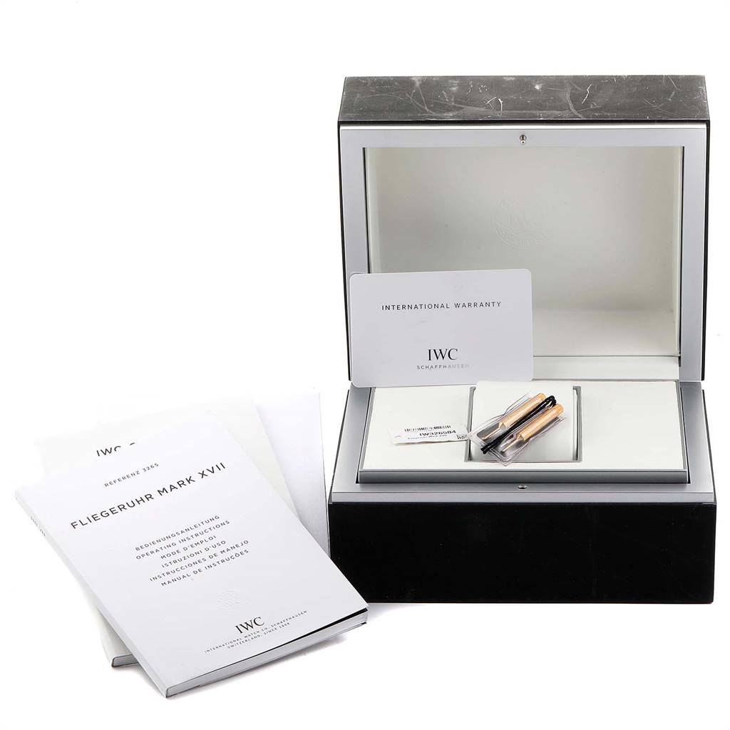 The image shows the box, manuals, and warranty card for the IWC Pilot IW326504 Men's Stainless Steel Black Dial IW326504 Men's Stainless Steel Black Dial Fliegeruhr Mark XVII watch from a front angle.
