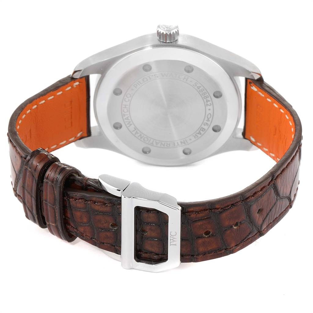 The image shows the back view of the IWC Pilot 5524G Men
s Stainless Steel Grey Dial 5524G Men
s Stainless Steel Grey Dial model watch, focusing on the case back, crown, and brown leather strap with a silver buckle.