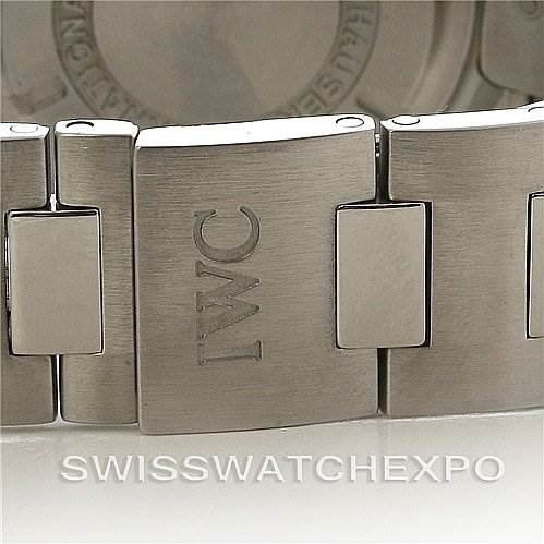 The image shows a close-up of the clasp and bracelet of a Vintage IWC watch, highlighting the engraved "IWC" logo.