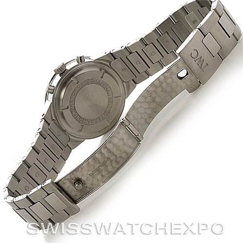 The image shows the back of a Vintage IWC watch, highlighting the closed clasp and the detailed metal bracelet.