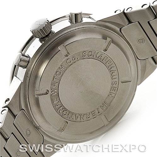 The image shows the back of the IWC Vintage Men's Stainless Steel Black Dial Men's Stainless Steel Black Dial watch, highlighting its caseback with branding details and part of the metal bracelet.