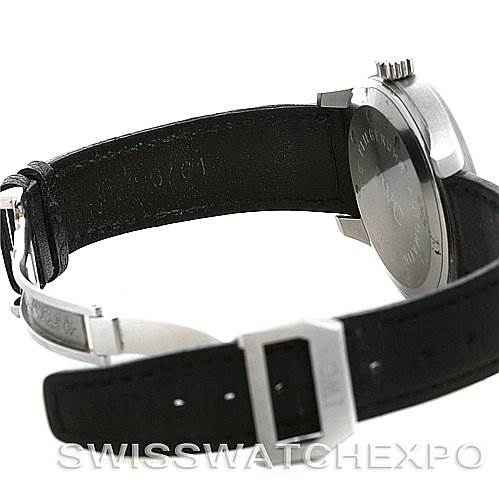 The image shows the back and side of a Pilot model watch by IWC, including its strap, buckle, and case back.