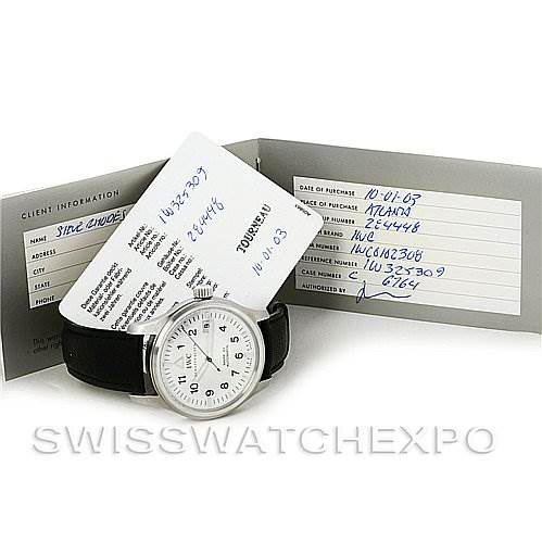 The image shows an IWC Pilot IWC325309 Men's Stainless Steel White Dial IWC325309 Men's Stainless Steel White Dial model watch with its warranty card and booklet, displayed at a slight angle.
