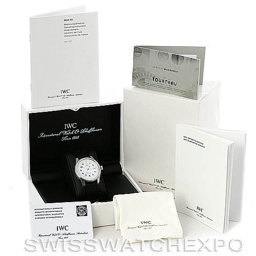 The IWC Pilot IWC325309 Men's Stainless Steel White Dial IWC325309 Men's Stainless Steel White Dial model watch is shown at an angle in its box, with accompanying manuals, warranty cards, and a cleaning cloth.