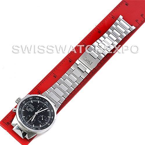 This image shows the top view of an IWC GST IW3707-008 Men's Stainless Steel Black Dial IW3707-008 Men's Stainless Steel Black Dial model watch, highlighting its stainless steel bracelet and clasp against a red ruler.