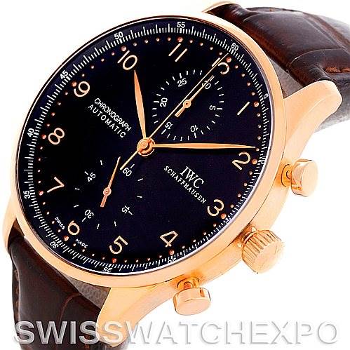 The image shows an IWC Portuguese IW3714-15 Men's Rose Gold Black Dial IW3714-15 Men's Rose Gold Black Dial Chronograph watch at an angled view, highlighting its face, dial, and side buttons.