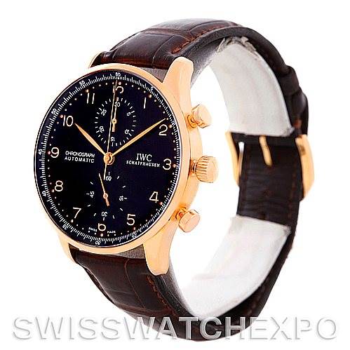 The image shows an IWC Portuguese IW3714-15 Men's Rose Gold Black Dial IW3714-15 Men's Rose Gold Black Dial watch with a black dial, rose gold case, and brown leather strap from a three-quarter angle.