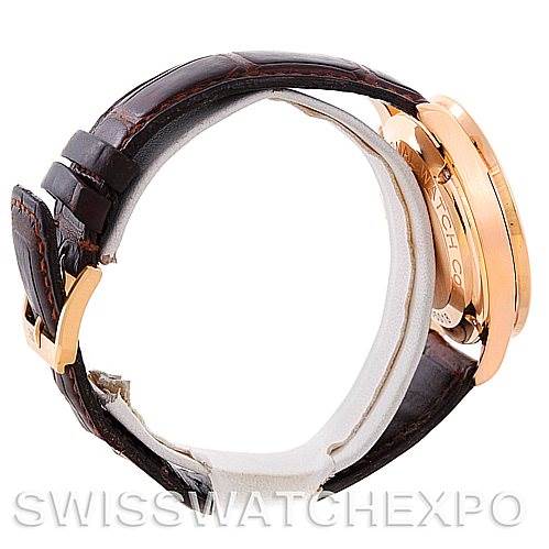 The image shows a side view of an IWC Portuguese IW3714-15 Men's Rose Gold Black Dial IW3714-15 Men's Rose Gold Black Dial model watch, featuring the case, crown, and leather strap with a clasp.